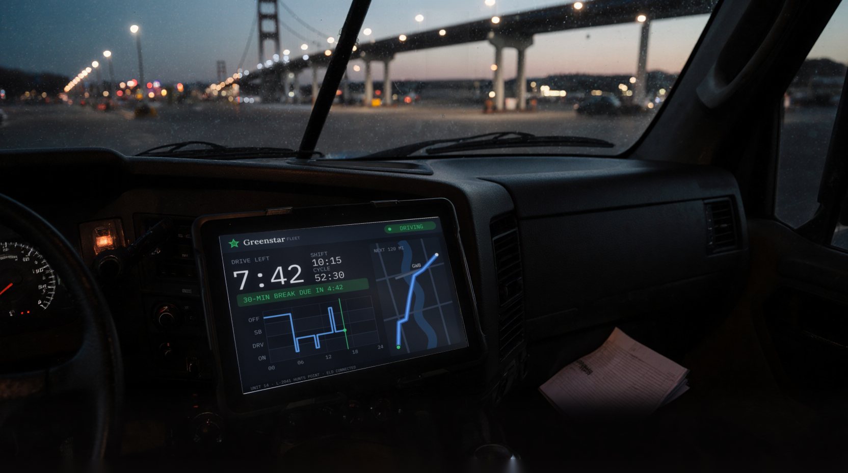 Illustration: inside a truck cab at dusk, a suspension bridge and an elevated highway through the windshield; a dash-mounted tablet shows an hours-of-service screen with 7:42 of drive time left, the shift and cycle clocks, a break-due bar, the duty log and a route map